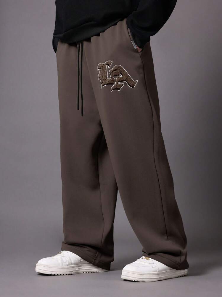 Pantaloni della tuta con cavallo basso e logo