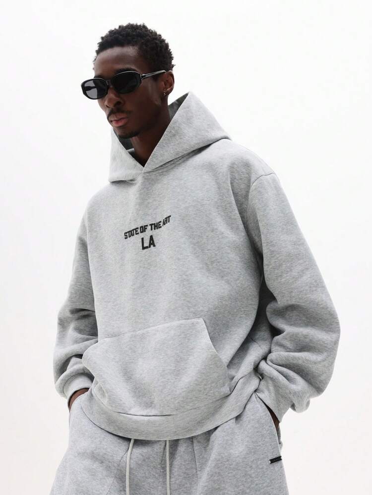 Sudadera con capucha estampada con texto de última generación