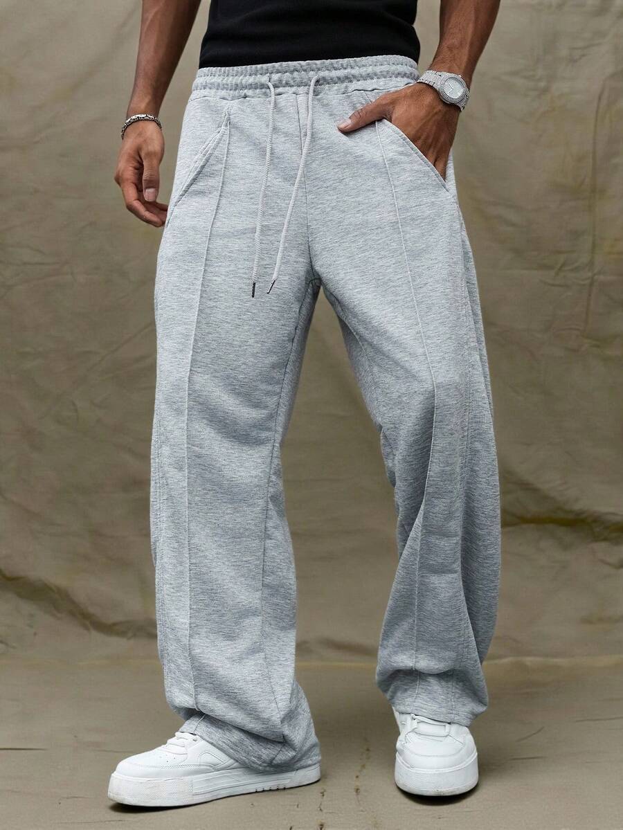 Manfinity Hypemode Pantalones de chándal grises casuales y con dobladillo dividido para hombres jóvenes - Gris - Ver 1