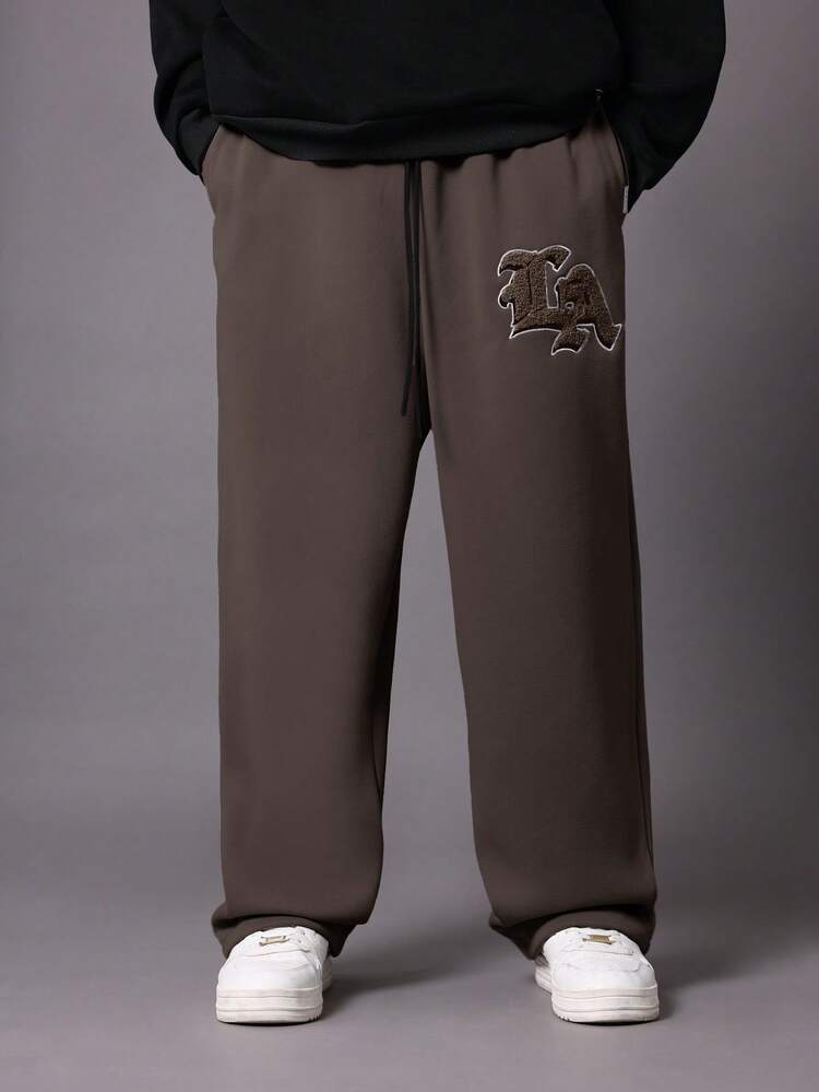 Pantaloni della tuta con cavallo basso e logo