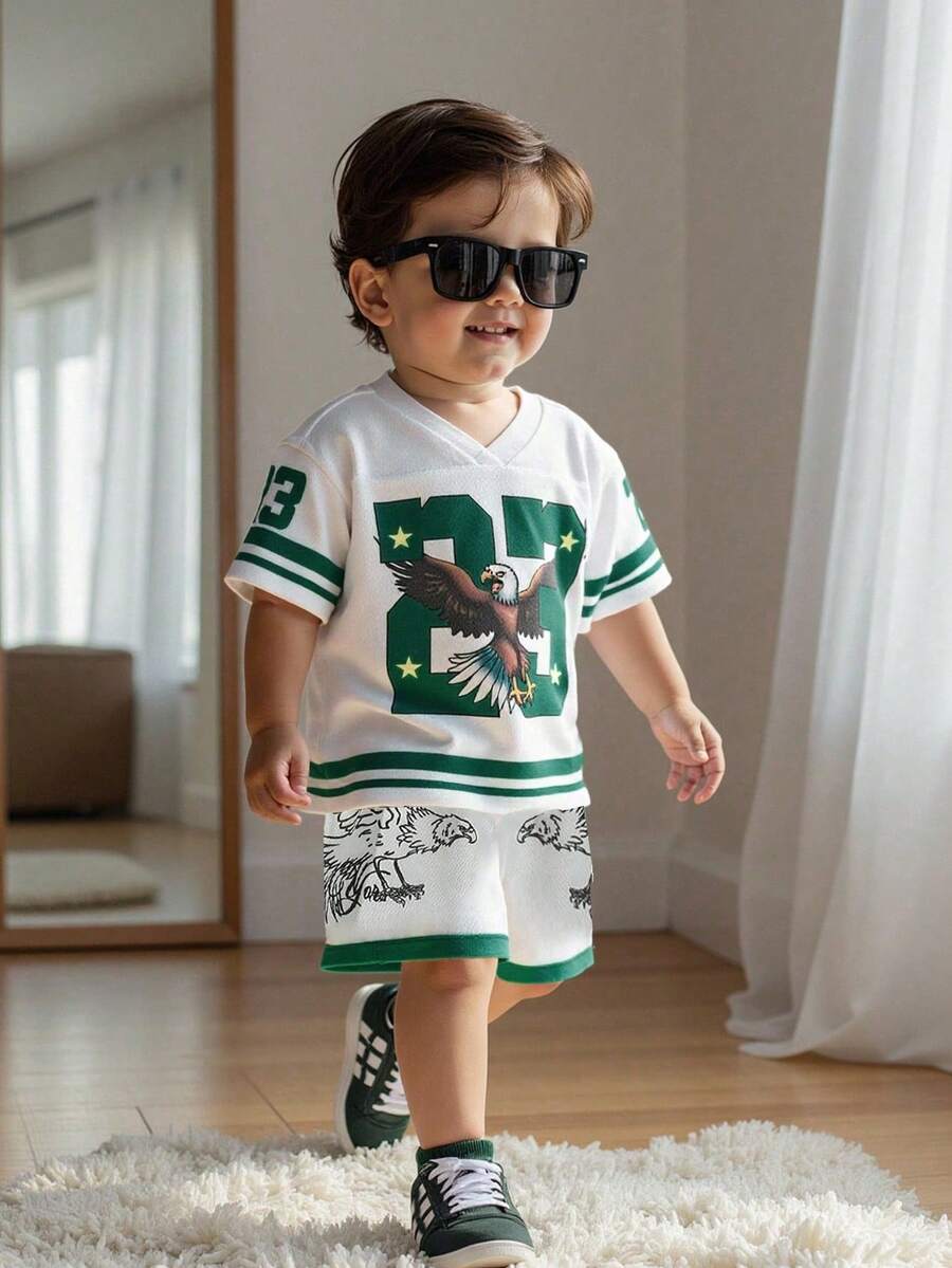 SHEIN Playful Pals Bộ 2 áo thun thể thao cổ chữ V tay ngắn dáng rộng thoải mái cho bé trai mới biết đi có họa tiết đại bàng và sọc + quần short lưới, quần áo trẻ sơ sinh/trẻ sơ sinh, 6 tháng-3 tuổi - trắng - Xem 1