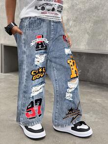 SHEIN 幼儿/男童水洗涂鸦字母印花破洞宽松直筒黑色牛仔裤，适合儿童穿着，街头服饰，四季皆宜。