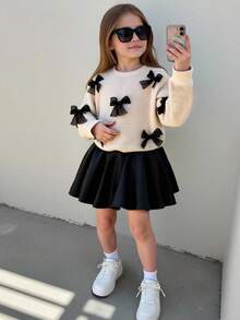 Set de 2 piezas: Blusa de manga larga con cuello redondo y decoración de moño 3D negro para niñas pequeñas, combinada con falda negra, estilo académico dulce y versátil, moda retro para otoño/invierno - Albaricoque - Ver 3