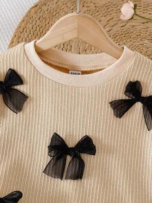 Set de 2 piezas: Blusa de manga larga con cuello redondo y decoración de moño 3D negro para niñas pequeñas, combinada con falda negra, estilo académico dulce y versátil, moda retro para otoño/invierno - Albaricoque - Ver 7