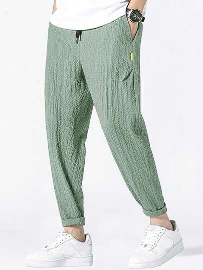 Manfinity Homme Loose Men Letter Patched Textured Tapered Pants Men Casual Pants Men Drawstring Pants, Fall