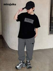 SHEIN 2pcs Tween Boys' Print Black Short Sleeve T-Shirt + Khaki Cargo Pants Casual Suit, Spring/Summer