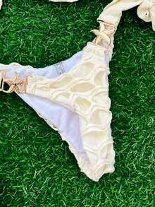Selianne Bộ 2 món đồ bơi đi biển mùa hè cho nữ, áo hở lưng gợi cảm và quần bikini buộc dây dễ thương, đồ bơi trơn màu trang trí kim loại - Màu be - Xem 6