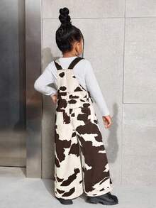 SHEIN 年轻女孩休闲时尚街头奶牛印花牛仔背带裤