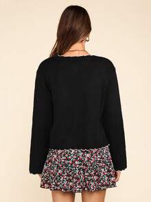 Coeurva Cardigan en laine noir avec bord contrasté en coquille, adapté pour le port quotidien dans la rue