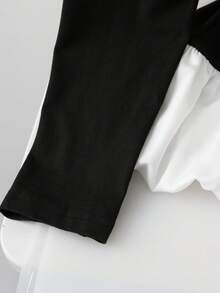 GlowEve Women's Autumn/Winter Knitted Elastic Round Neck Asymmetric Peplum Hem Colorblock Casual T-Shirt - Black and White - View 5