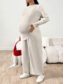 SHEIN 2pcs Maternity Plus Size Solid Color Asymmetric Shoulder Drop Shoulder Long Sleeve Top And Adjustable Waist Wide Leg Pants Casual Outfit Pregnant Outfits Maternity Pants Set Pregnancy Clothes Plus Size Maternity Set Maternity 2 Piece Set - Beige - View 5