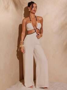 Hauture Sexy Sommer-Boho-Jumpsuit mit Kontrastdetails, kontrastfarbenen Bündchen, Cut-Outs und Perlenverzierungen – perfekt für den Urlaub und den Tag.