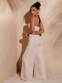 Hauture Sexy Sommer-Boho-Jumpsuit mit Kontrastdetails, kontrastfarbenen Bündchen, Cut-Outs und Perlenverzierungen – perfekt für den Urlaub und den Tag.
