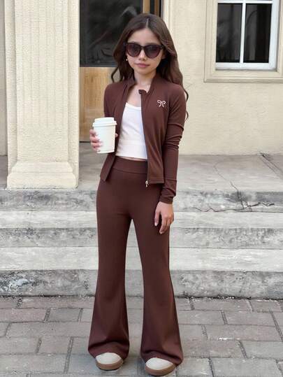 SHEIN Conjunto de camiseta de manga larga acanalada negra linda con falda con decoración de lazo y bajo dividido para niñas preadolescentes, conjunto de camiseta de otoño/invierno