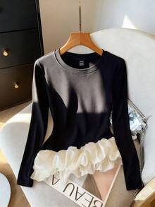 GlowEve Women's Autumn/Winter Knitted Elastic Round Neck Asymmetric Peplum Hem Colorblock Casual T-Shirt - Black and White - View 1