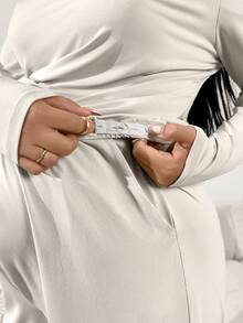 SHEIN 2pcs Maternity Plus Size Solid Color Asymmetric Shoulder Drop Shoulder Long Sleeve Top And Adjustable Waist Wide Leg Pants Casual Outfit Pregnant Outfits Maternity Pants Set Pregnancy Clothes Plus Size Maternity Set Maternity 2 Piece Set - Beige - View 3