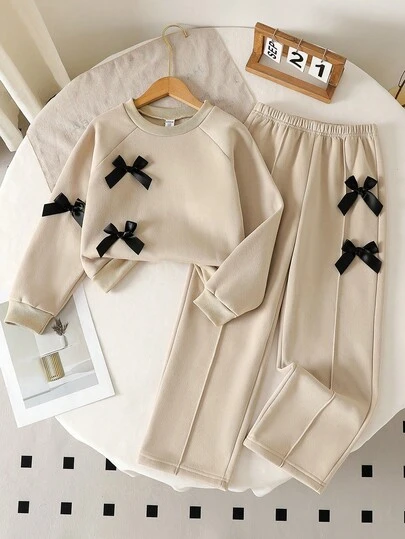 Genkimix Kids مجموعة من قطعتين للفتيات الصغيرات، تتكون من ملابس علوية بياقة مستديرة وأكمام طويلة باللون الرمادي وبنطال ذو ساق واسعة مزين بفيونكة، للخريف/الشتاء