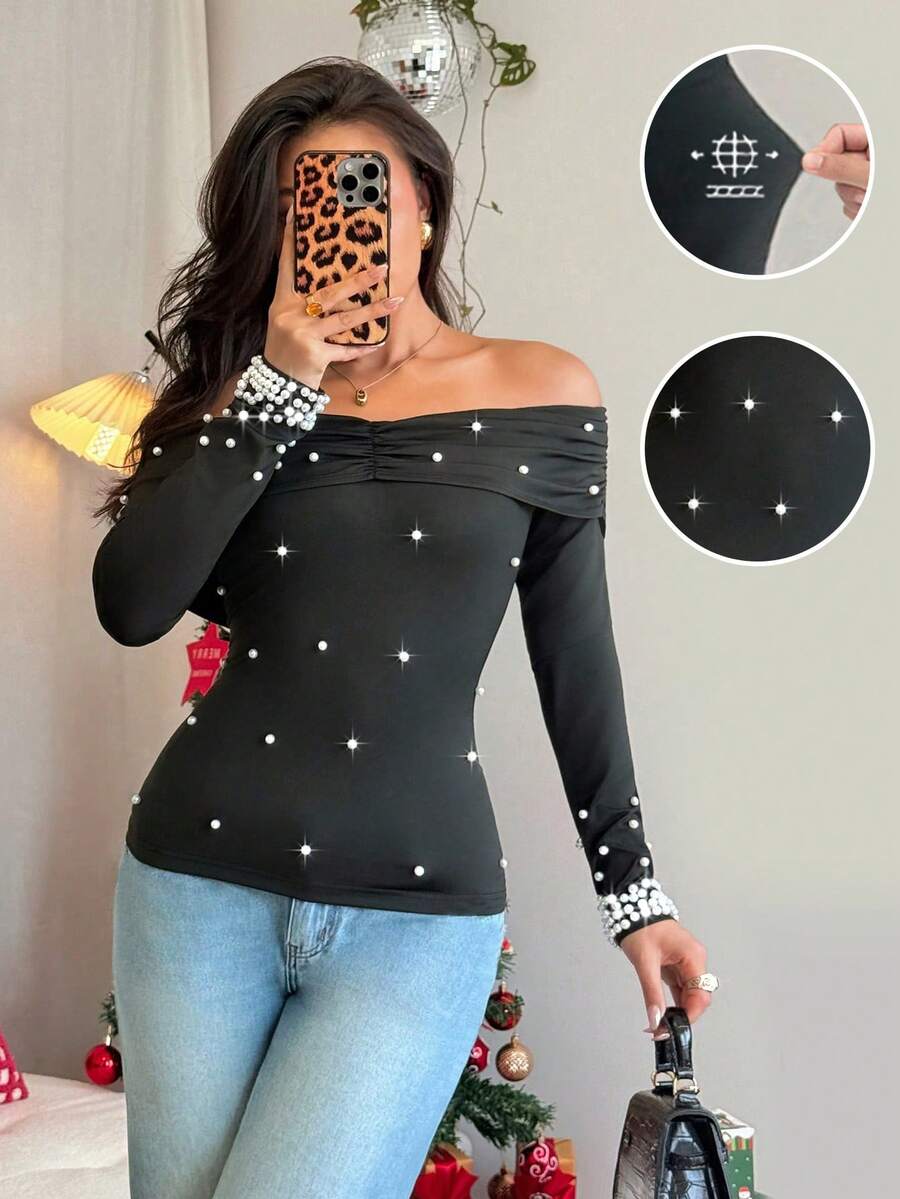 Rafferiza Camiseta de manga larga con hombros descubiertos, volantes y perlas falsas, sexy y elegante, que define la cintura, para mujer en otoño y invierno, para fiestas, Navidad - Negro - Ver 1