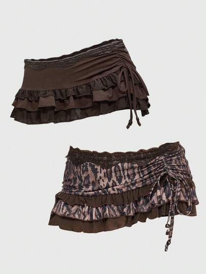 Grunge Punk Jupe mini sexy à taille basse avec volants, nœud et imprimé léopard, style vintage à dentelle superposée. Idéal pour les festivals de printemps, concerts et Saint-Valentin pour femmes