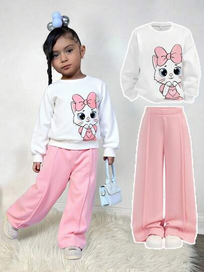 SHEIN Conjunto informal de niña de sudadera de manga larga con estampado de dibujos animados y hombros caídos, y pantalón de chándal de pierna ancha de unicolor