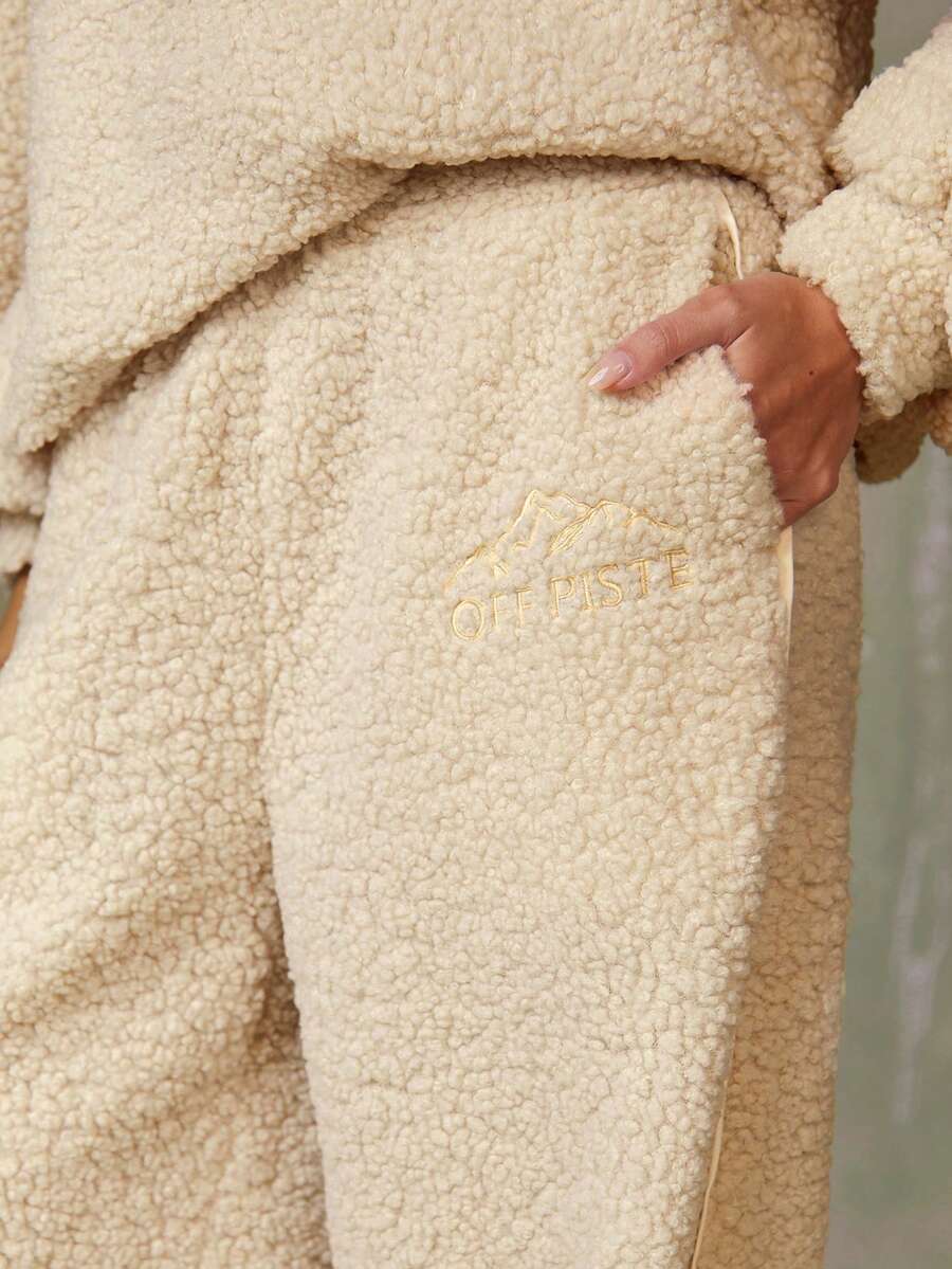 Athîral 2025 冬季新款保暖内衬裤 - Off Piste 标语泰迪熊抓绒慢跑裤，蓬松裤，阔腿运动裤，保暖舒适的运动休闲裤，宽松女裤，适合女性健身、滑雪和圣诞假期冬季穿着。 - 米色 - 查看 1