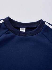 Casuvi Kids Casuvi 女童两件套：粉色针织套头卫衣和阔腿裤，蝴蝶结装饰，侧边撞色滚边，休闲可爱的美式风格，适合春秋季日常穿着、运动和度假。 - 藏蓝色 - 查看 11