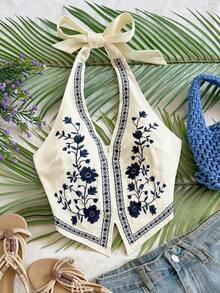 Soleia 杏色底黑色花卉刺绣露背吊带短款上衣，带蝴蝶结，适合音乐节穿着。 - 彩色 - 查看 3