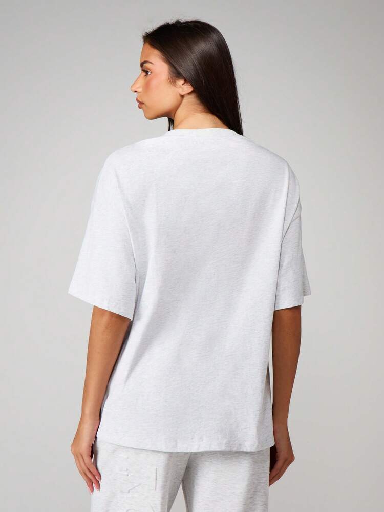 Missguided x Playboy Oversized Graphic T Shirt With Logo Print And Short Sleeves For Casual Everyday Wear