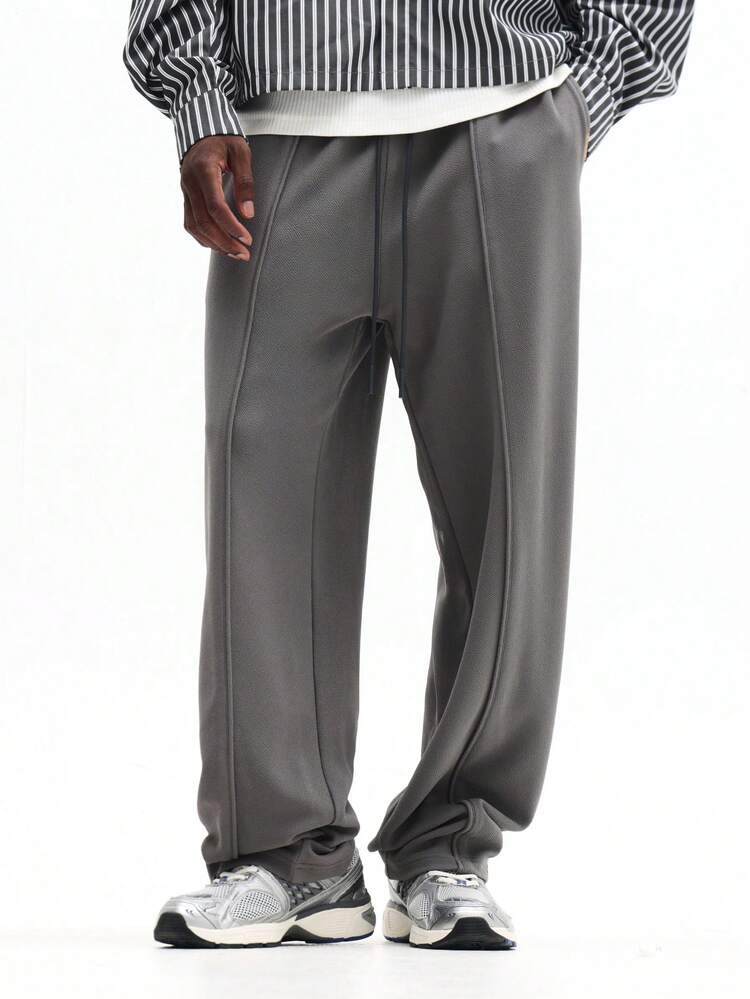 Pantalon de survêtement texturé à plis piqués et cordon de serrage