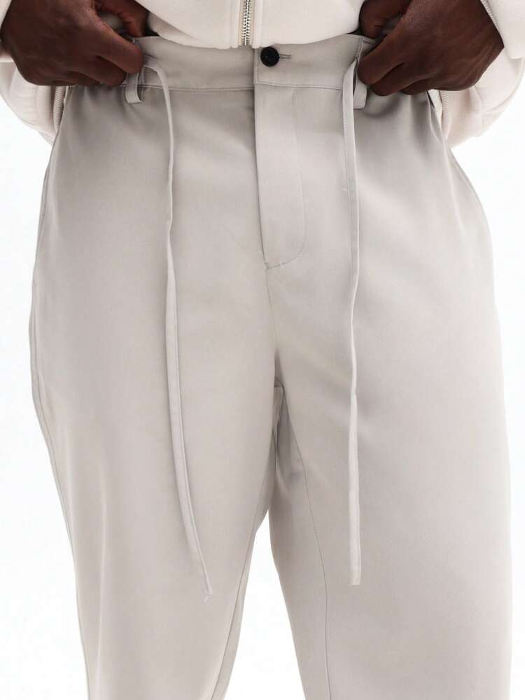 Spodnie dresowe ze ściągaczem i elastycznymi mankietami