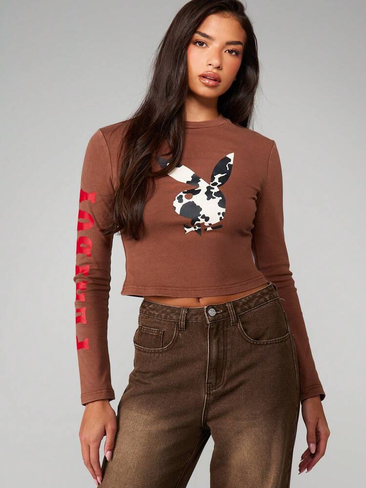 Missguided x Playboy Fitted Long Sleeve Crop Top With Cow Print Bunny Graphic And Red Sleeve Text For Casual Streetwear