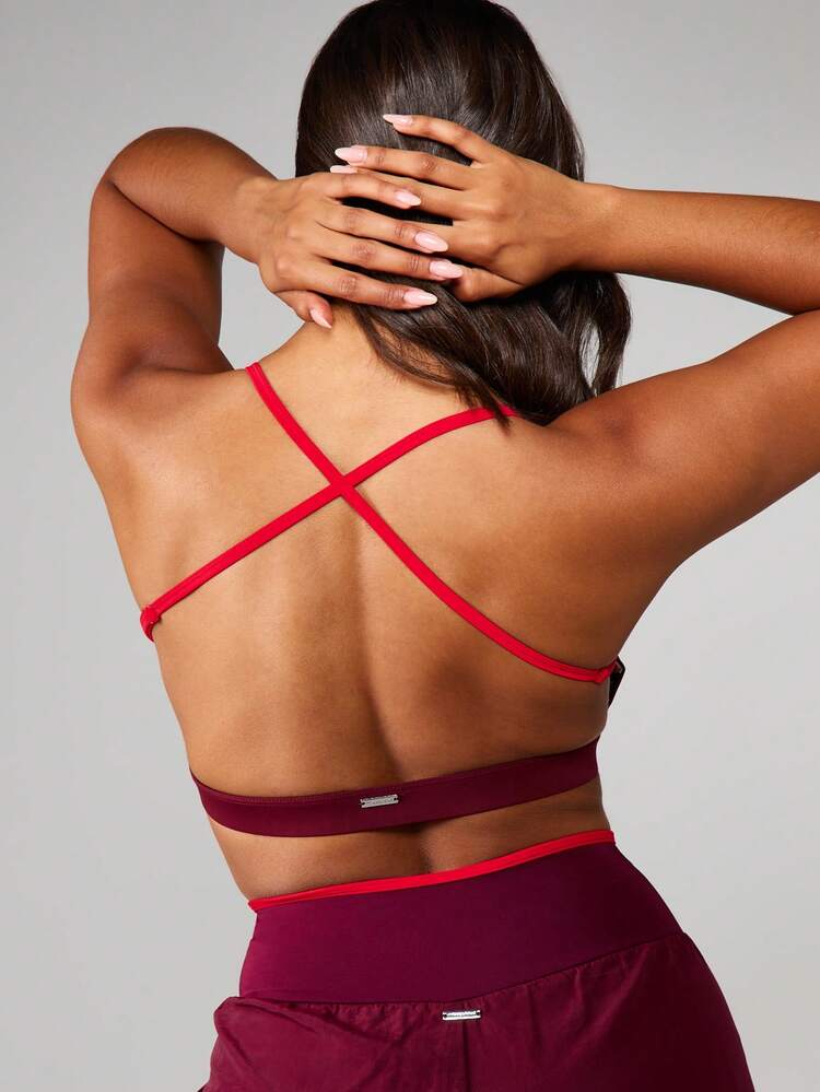 Missguided x Playboy Sports Bra With Criss Cross Back And Contrast Piping For Athletic Performance