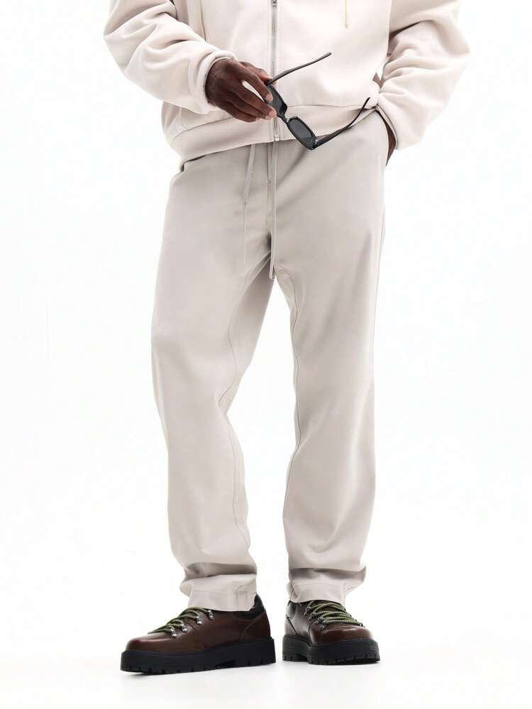 Spodnie dresowe ze ściągaczem i elastycznymi mankietami