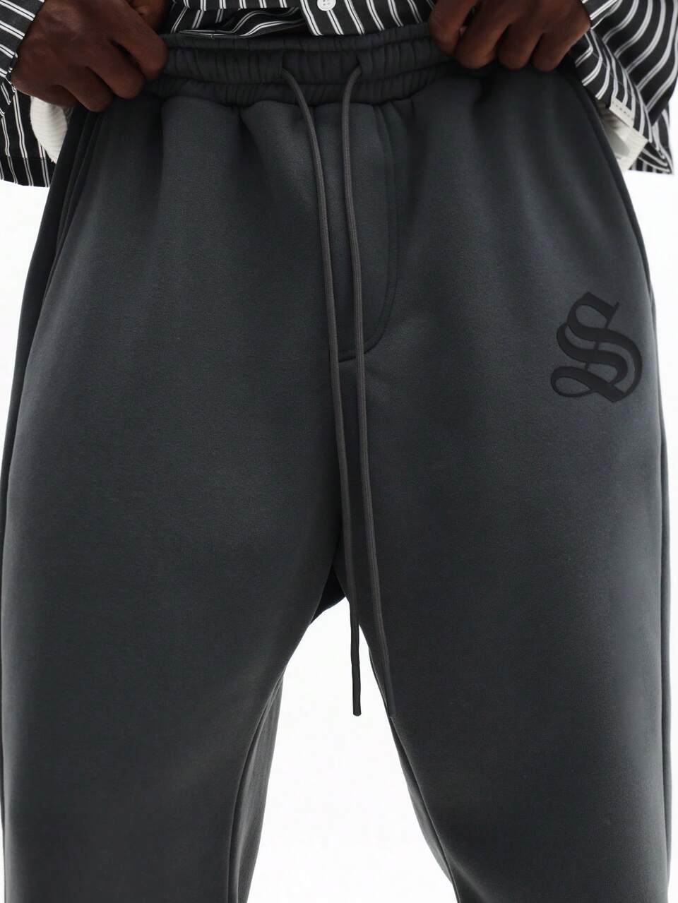 Pantalon de survêtement évasé avec logo en relief