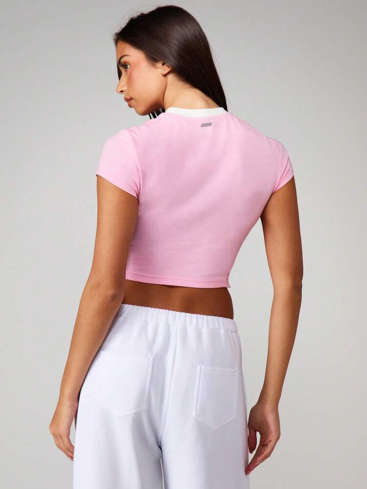 Missguided x Playboy Apres Ski Graphic Baby Tee Short Sleeve Crop Top With White Contrast Trim Mountain Print