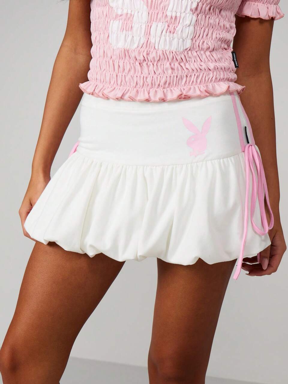 Missguided x Playboy Bunny Logo Mini Skirt With Side Tie Details And Ruffle Hem For Summer Festival Occasions