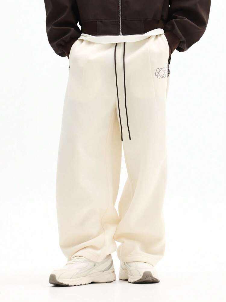 Pantaloni della tuta con cavallo basso e nastro laterale