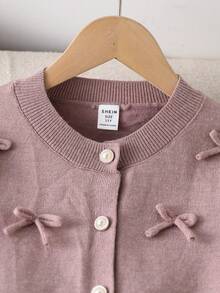 Conjunto de suéter para niñas preadolescentes, suéter de punto hecho a mano con cuello redondo, botones, manga larga y lazo a juego + falda mini plisada del mismo color, corte holgado, suave y cómodo, adecuado para primavera/otoño, uso diario, exterior, viajes, vacaciones, hogar y juegos de niños