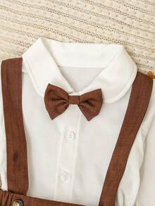 SHEIN 两件套男婴可爱绅士风正式套装，包括白色长袖领衬衫（带蝴蝶结）和休闲背带裤，时尚优雅帅气，适合生日派对、庆典、演出、婚礼、迎婴派对、洗礼等正式场合，春秋季穿着。 - 咖啡棕 - 查看 3
