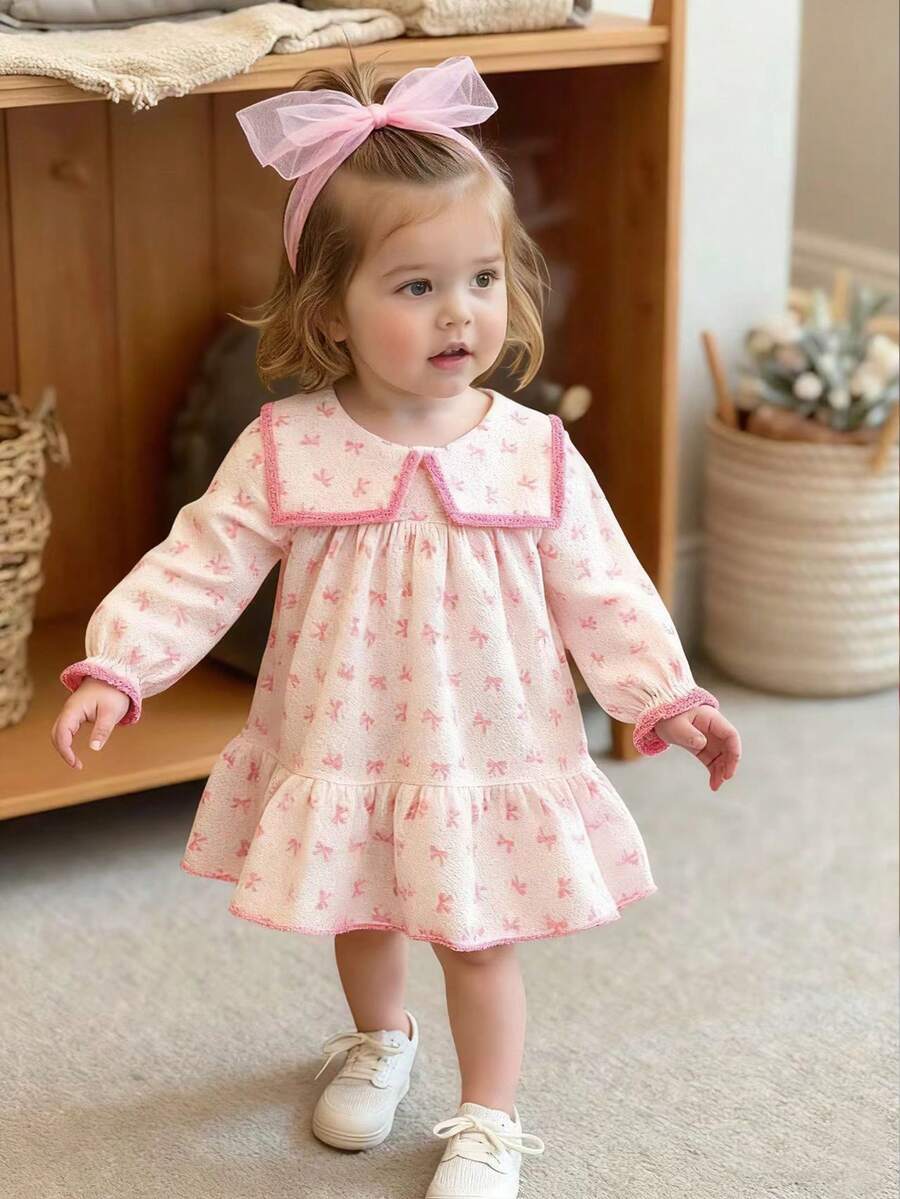 SHEIN Souflis Đầm chữ A tay bồng cổ bèo nhún cho bé gái kèm băng đô nơ vải tuyn. Cổ áo rộng, tay bồng và dáng chữ A tạo nên vẻ ngoài thời trang và cổ điển. Dù đi chơi hay mặc nhà, bé yêu của bạn sẽ trở thành nàng công chúa lấp lánh. - Bụi hồng - Xem 1