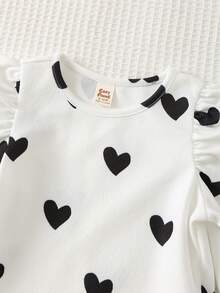 Cozy Pixies Conjunto de 2 piezas de top de manga larga con cuello redondo suave y pantalones de cintura elástica con estampado de corazón para bebé niña - Blanco y Negro - Ver 6