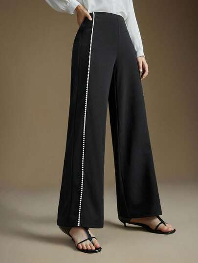 Ontre 2025秋冬优雅浪漫都市职业通勤商务休闲正装，适合工作场所、办公室、婚礼、约会、派对、音乐会、早午餐、机场、万圣节、圣诞节、国庆节、新年等场合，采用黑色直筒裤搭配珍珠饰边面料。