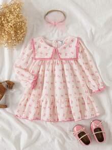 SHEIN Souflis Đầm chữ A tay bồng cổ bèo nhún cho bé gái kèm băng đô nơ vải tuyn. Cổ áo rộng, tay bồng và dáng chữ A tạo nên vẻ ngoài thời trang và cổ điển. Dù đi chơi hay mặc nhà, bé yêu của bạn sẽ trở thành nàng công chúa lấp lánh. - Bụi hồng - Xem 3