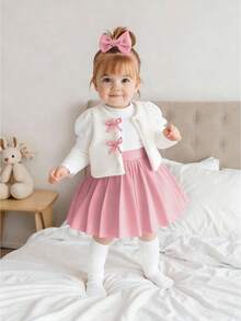 Souflis Souflis 2-Piece Baby Girl Winter White Long Sleeve Knit Top + White Fuzzy Vest + Red Plaid Skirt Set - Pink - View 1