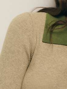 Nöista 这款罗纹毛衣采用撞色领口和精致的前开衩设计，优雅百搭，是女士冬季的理想之选；既适合办公室穿着，又足够精致，可以搭配出圣诞节造型、新年聚会和季节性叠穿装扮。 - 杏色 - 查看 4