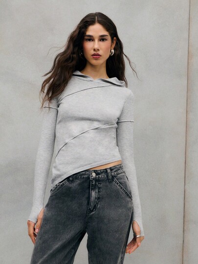 TypaGal Elegant Grey Fitted Hoodie With Diagonal Seam Detailing And A Soft, Modern Silhouette. The Perfect Mix Of Casual Comfort And Chic Sophistication.