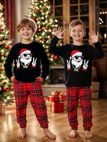 SHEIN Bộ đồ ngủ dài tay cổ tròn in hình ông già Noel dành cho trẻ em/bé trai tuổi teen, gồm áo và quần in họa tiết kẻ caro, màu đen và đỏ, phù hợp cho mùa thu/đông - Nhiều màu - Xem 2