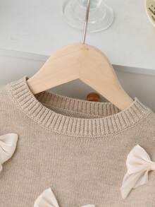 SHEIN Playful Pals 女童圆领休闲时尚蝴蝶结针织毛衣连衣裙，时尚可爱，适合居家、外出、聚会、返校等场合。 - 杏色 - 查看 7