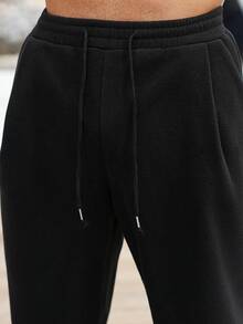 Manfinity CasualCool Pantalones de chándal casuales de unicolor y cálidos con barra ancha para hombres, pantalones de chándal negros - Negro - Ver 7