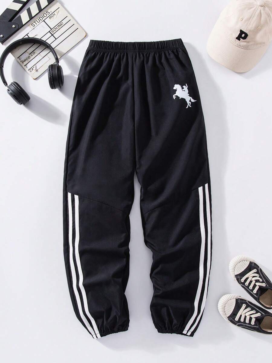 SHEIN Explorewe Pantalones con estampado de rayas asimétrico versátil y combinable para niños preadolescentes